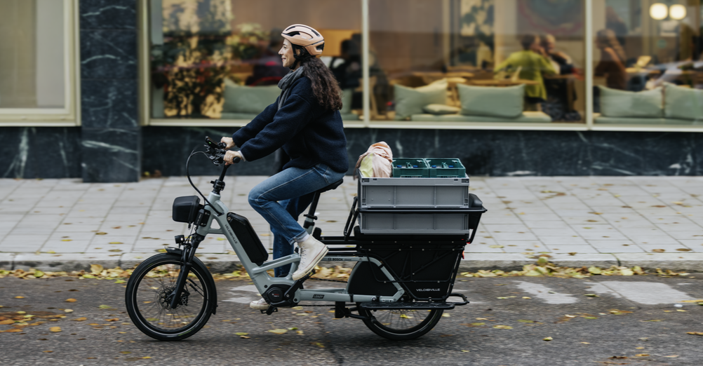 A woman on a cargo bike with a Bosch e-bike system.